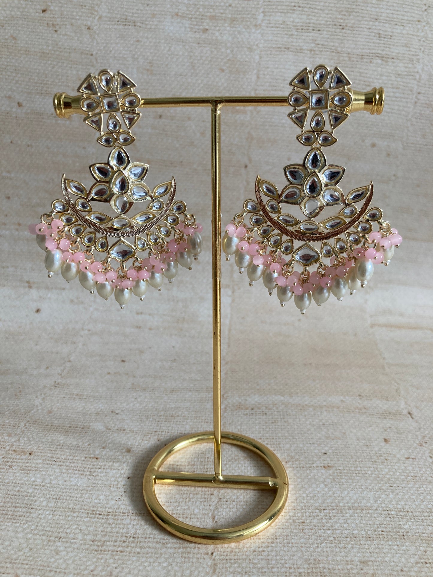 Ravina Pink Gold Plated Kundan Pearl Earrings And Tikka Set (ST942)